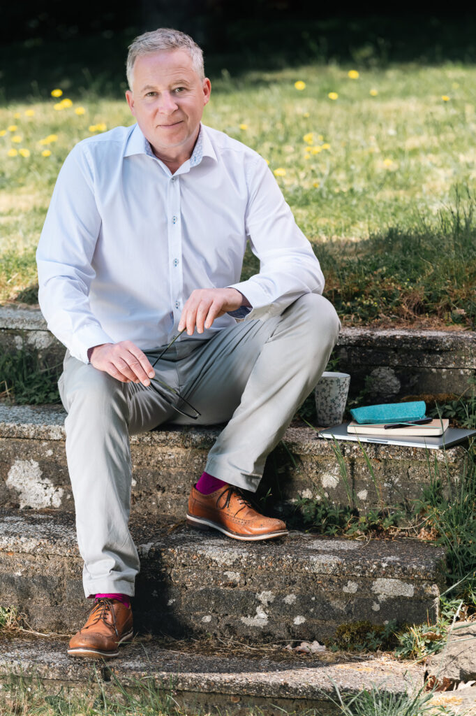 James Spice - tintac marketing consultant - sitting on steps outside