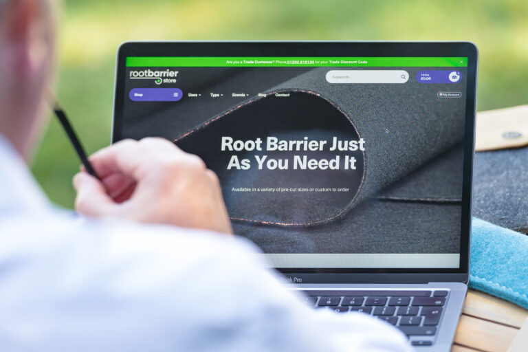 Root Barrier Store homepage pictured on outdoor laptop